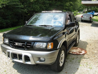 Illustration for article titled For $4,650, This 2002 Isuzu Rodeo Will Flip Its Lid, And That’s No Lie